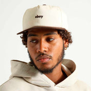 CAP OBEY CASE 5 PANEL SNAPBACK UNBLEACHED MULTI