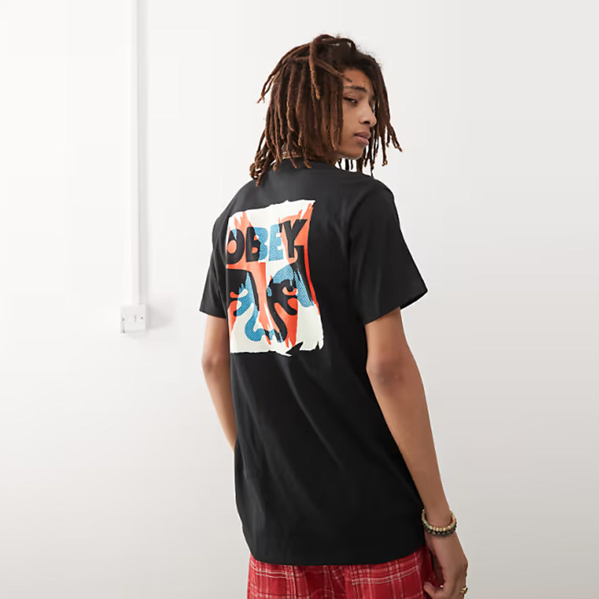 POLERA OBEY TORN POSTERS ICON BLK